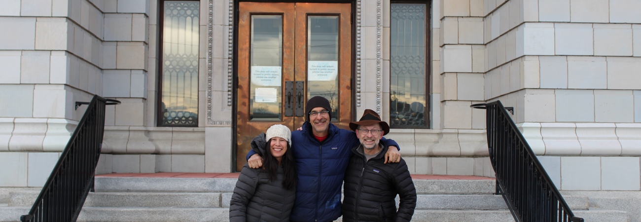 Commissioners Standing In Front Of The Courthouse During Winter