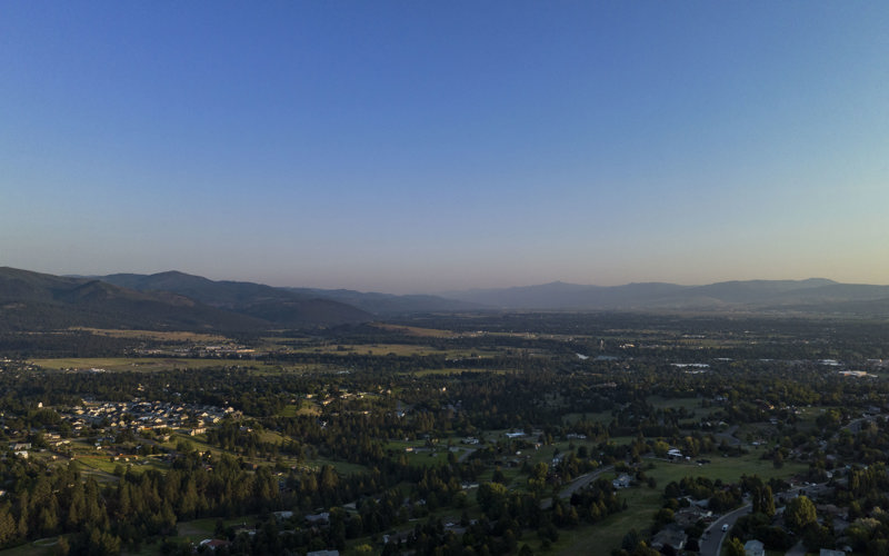 Aerial landscape of Missoula Valley in summer with the Bitterroot mountains in the background