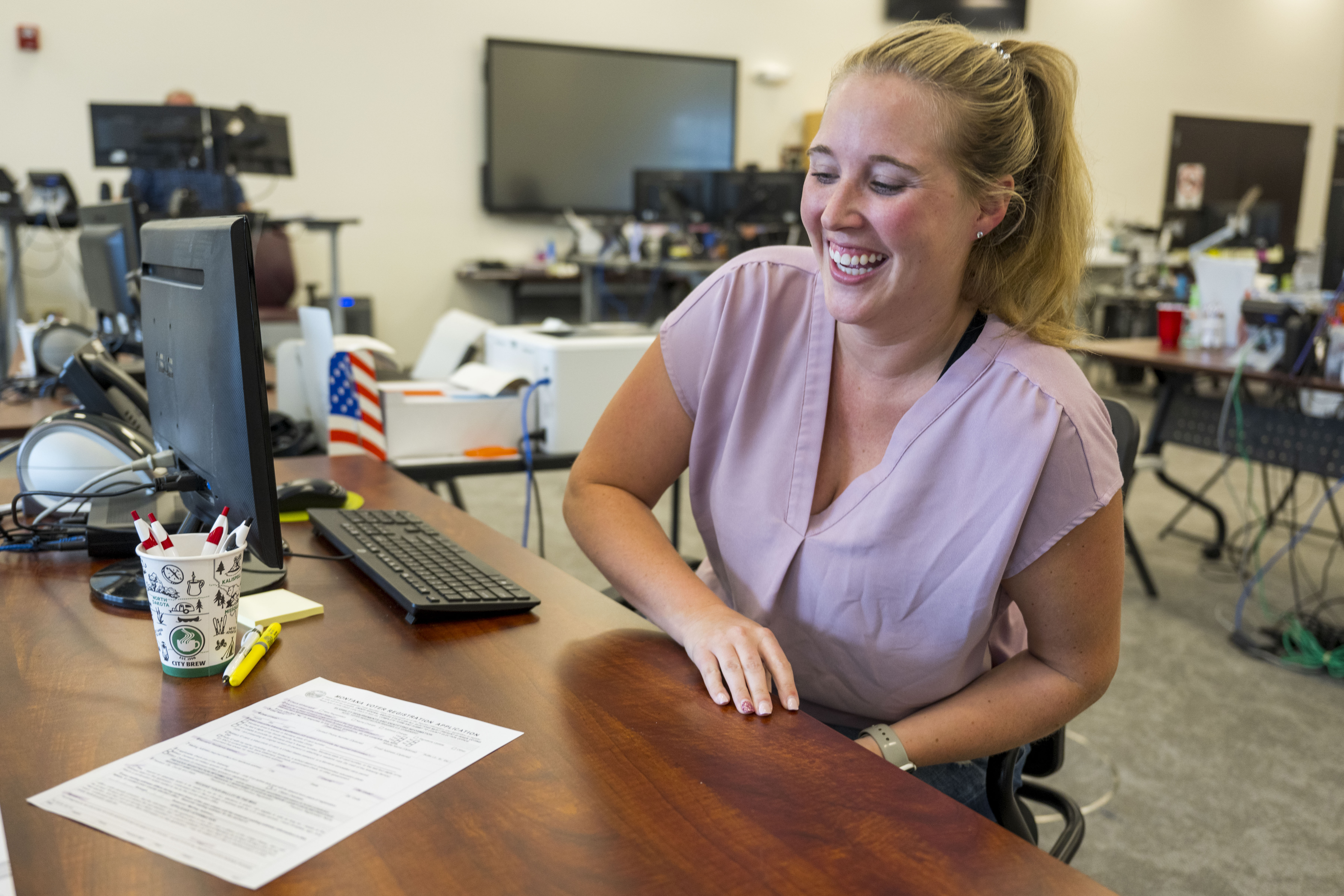 Election Worker At Desk With Computer
